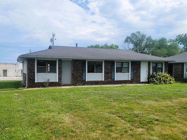 ranch-style house featuring a front lawn