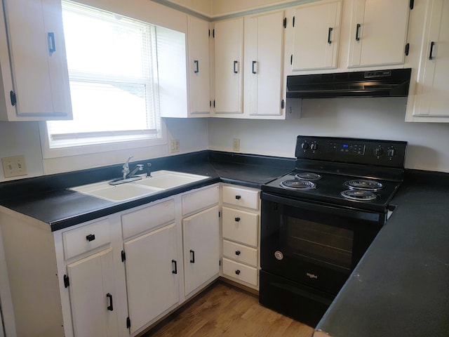 kitchen featuring hardwood / wood-style flooring, sink, black range with electric cooktop, and white cabinetry