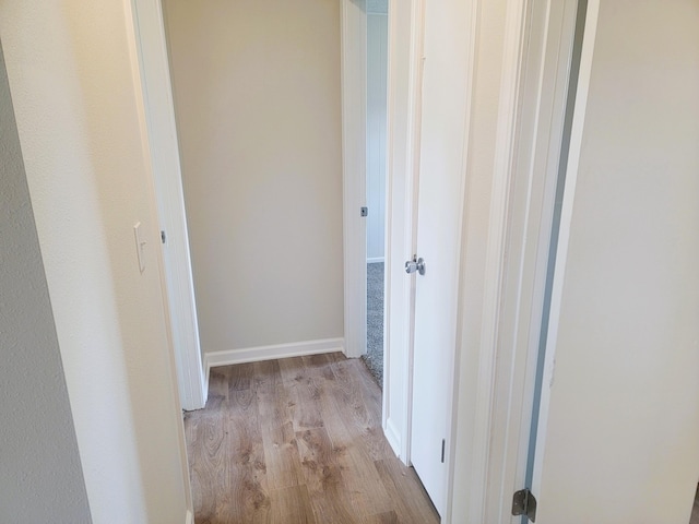 corridor featuring light hardwood / wood-style flooring