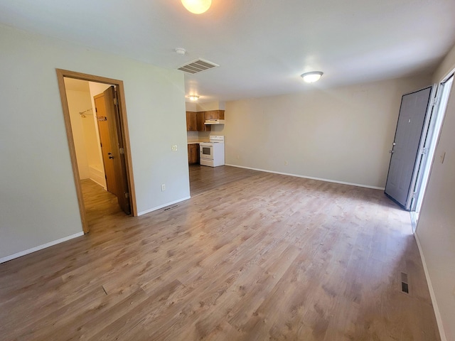 unfurnished living room with light hardwood / wood-style flooring