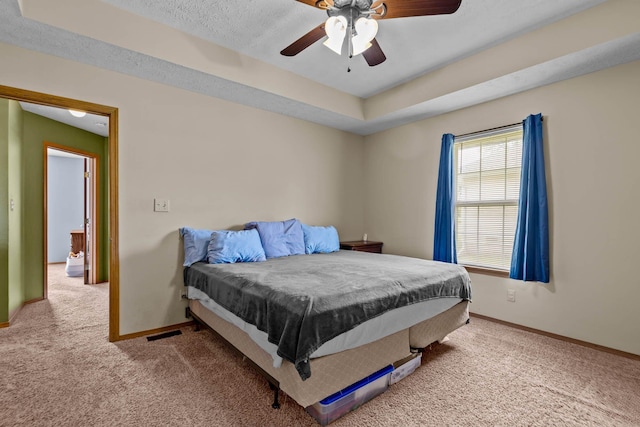 bedroom with a textured ceiling, pool table, ceiling fan, and light colored carpet