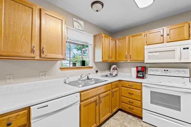 kitchen with sink and white appliances