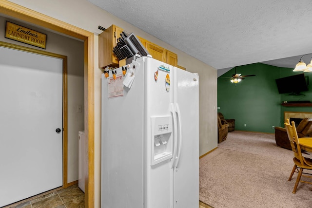 kitchen with ceiling fan, light brown cabinets, carpet floors, a textured ceiling, and white fridge with ice dispenser