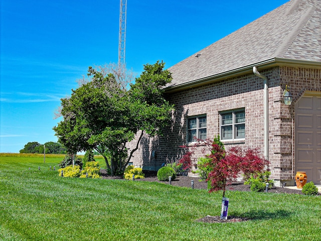 view of side of property featuring a yard