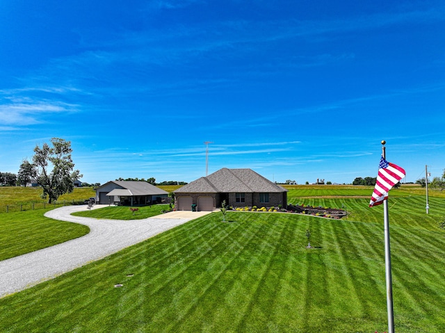 view of front of home featuring a garage and a front lawn