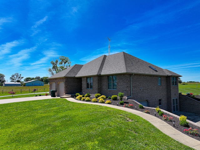 view of front of home featuring a garage and a front lawn