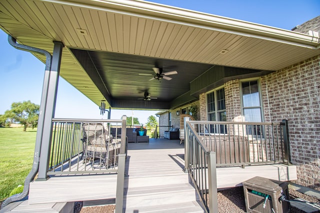 wooden terrace featuring a porch and ceiling fan