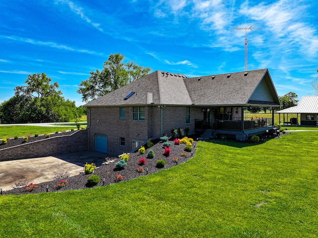 rear view of house with a yard