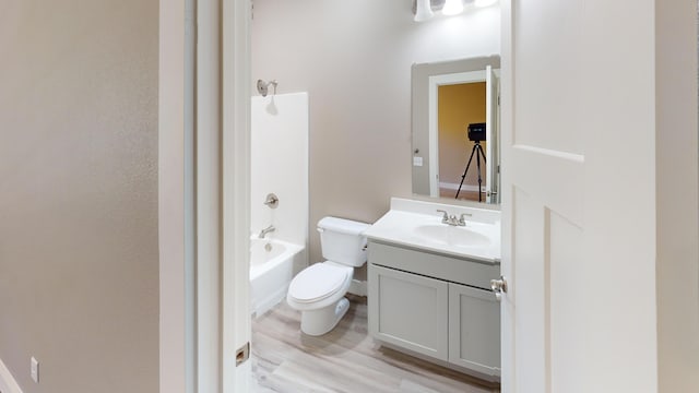500 Timber Wolf Rd, Hollister, MO 65672 - full bathroom with toilet, shower / washtub combination, wood finished floors, and vanity