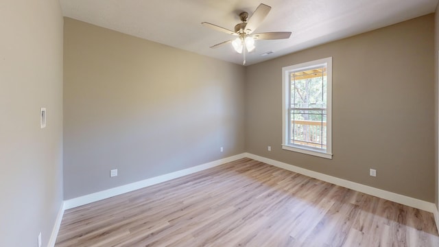 500 Timber Wolf Rd, Hollister, MO 65672 - spare room with light wood-type flooring, a ceiling fan, and baseboards