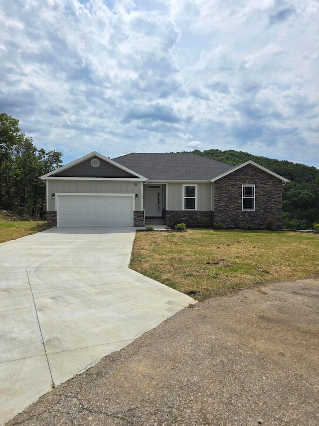 single story home with a front lawn and a garage