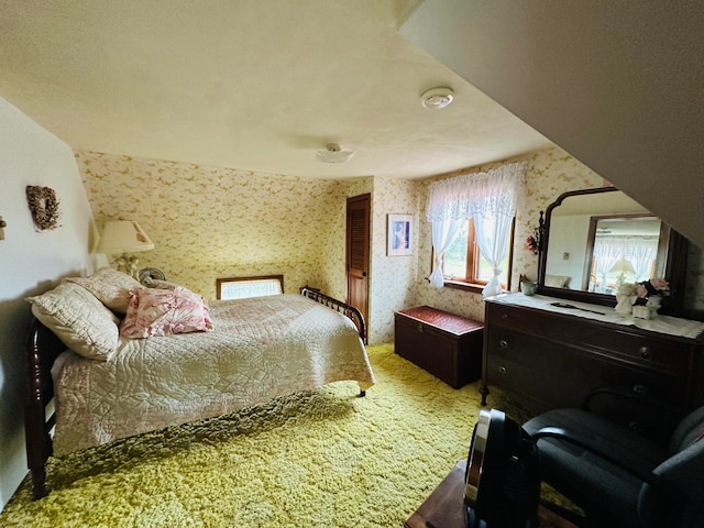 carpeted bedroom featuring vaulted ceiling