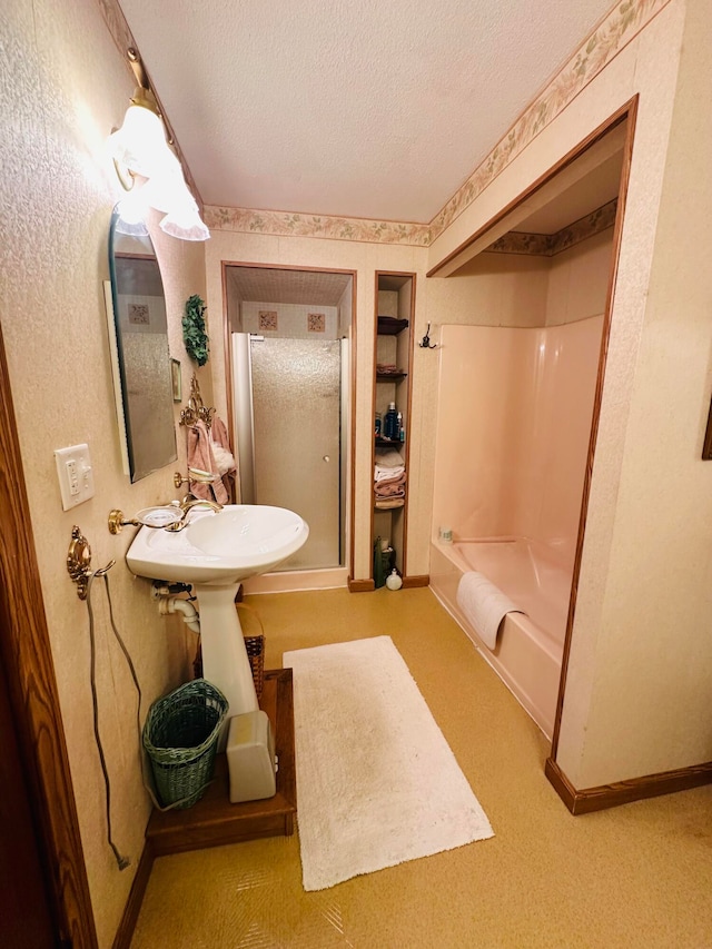 bathroom featuring shower / bathtub combination and a textured ceiling