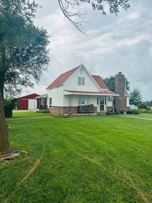 rear view of house with a lawn