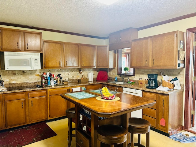 kitchen featuring ornamental molding, a textured ceiling, sink, and white appliances