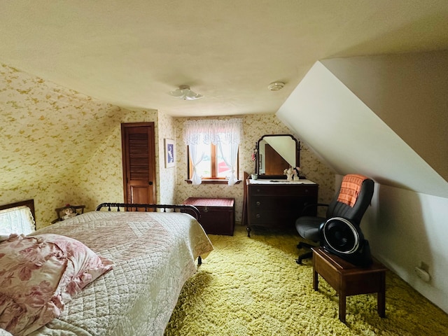 bedroom with lofted ceiling and carpet