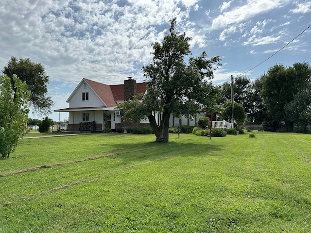 view of yard with covered porch