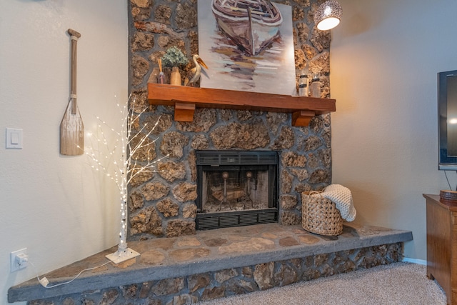 unfurnished living room featuring a fireplace and carpet flooring