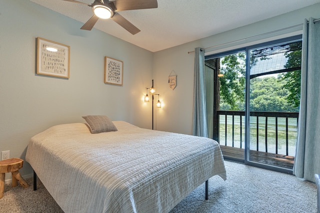 bedroom featuring ceiling fan, a textured ceiling, access to outside, and carpet