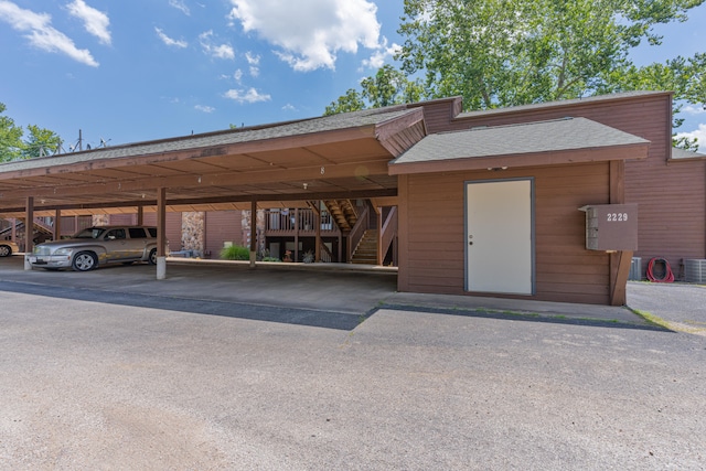 exterior space featuring a carport