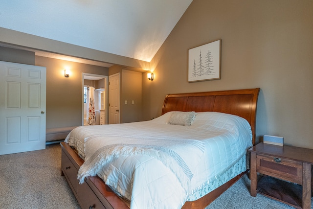 bedroom with light colored carpet and vaulted ceiling