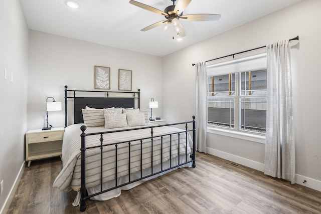 bedroom with ceiling fan and hardwood / wood-style floors