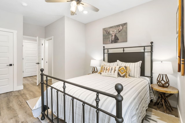 bedroom featuring light wood-type flooring and ceiling fan