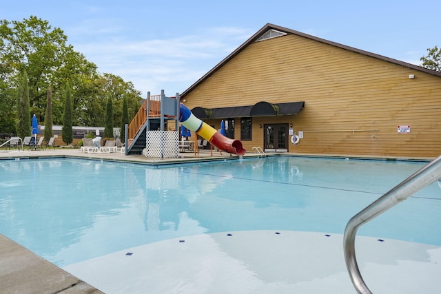 view of pool featuring a water slide