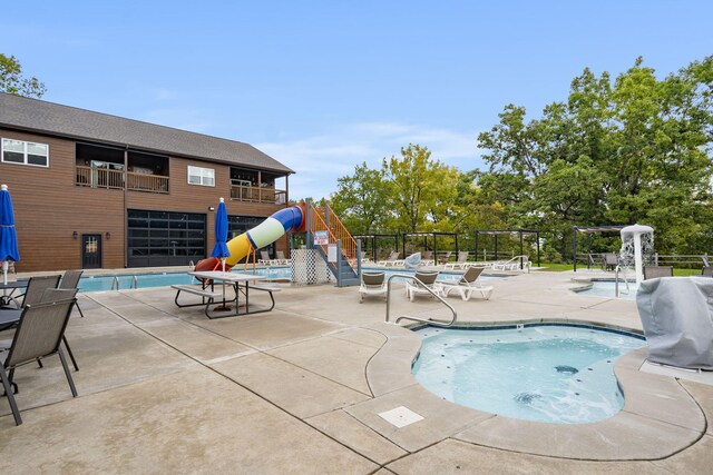 view of swimming pool with a patio