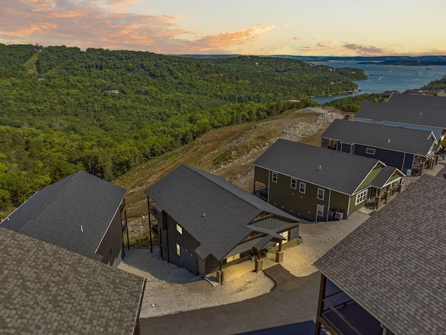 aerial view at dusk with a water view