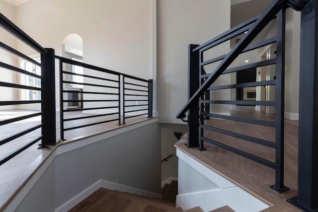 staircase featuring hardwood / wood-style flooring