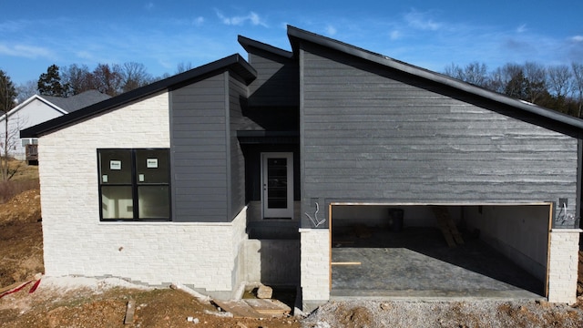 view of property exterior with a garage