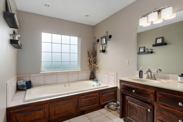 bathroom with vanity, a washtub, and tile patterned floors