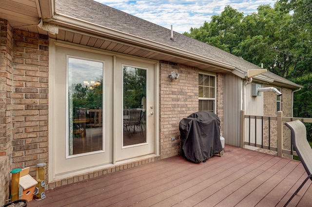 wooden deck featuring area for grilling