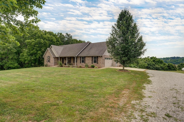 view of front of house featuring a front yard and a garage