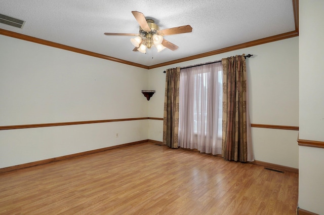 unfurnished room with ceiling fan, ornamental molding, a textured ceiling, and light hardwood / wood-style floors