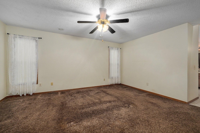 unfurnished room with light carpet, ceiling fan, and a textured ceiling