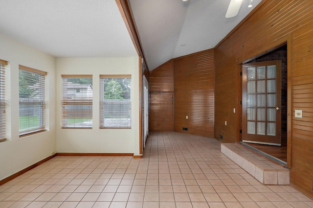 unfurnished sunroom with ceiling fan and lofted ceiling