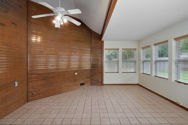 unfurnished sunroom featuring lofted ceiling and ceiling fan