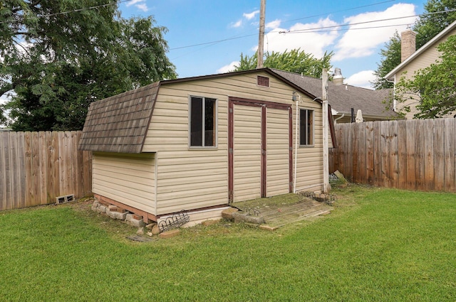 view of outbuilding with a yard