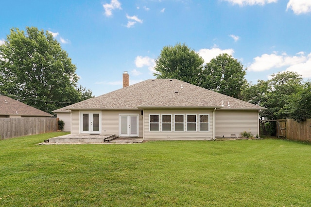 rear view of house with a lawn