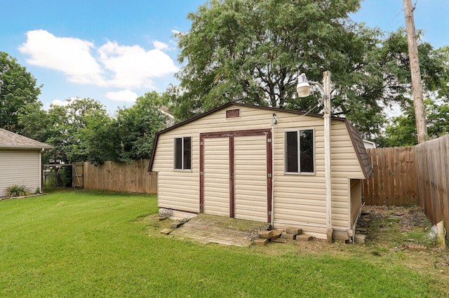 view of outdoor structure featuring a lawn