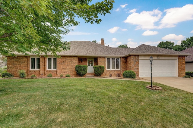 single story home with a garage and a front lawn