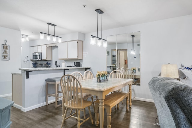 dining room with dark wood-type flooring