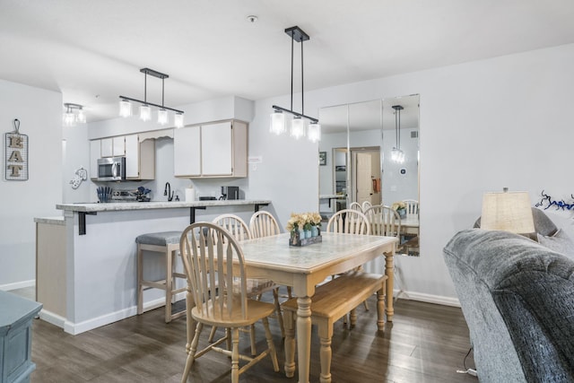 123 Bunker Ridge Dr Unit 7, Branson, MO 65616 - dining space with dark wood finished floors and baseboards