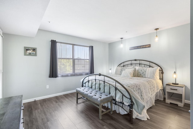 bedroom featuring dark hardwood / wood-style flooring