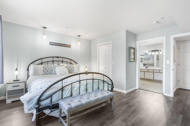 bedroom featuring dark hardwood / wood-style floors and ensuite bathroom