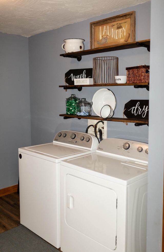 clothes washing area featuring a textured ceiling, dark hardwood / wood-style floors, and independent washer and dryer