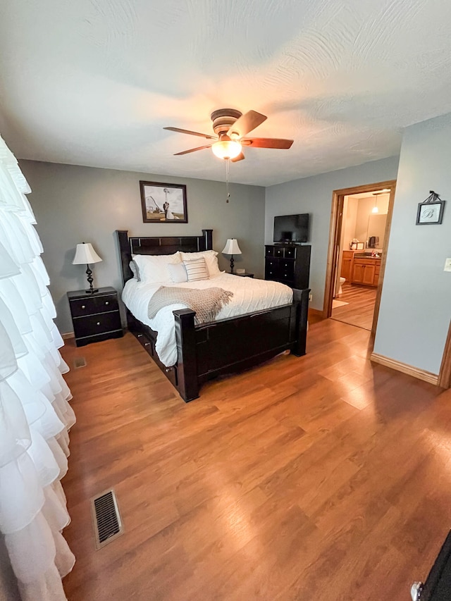 bedroom featuring ceiling fan and wood-type flooring