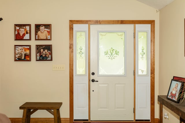 foyer entrance with vaulted ceiling